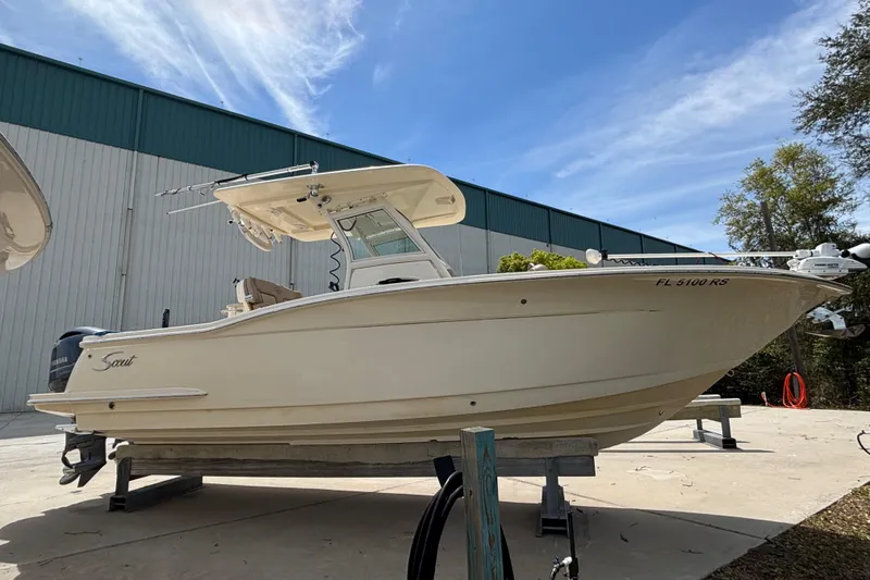 Slide: The Image of 2016 Scout 255 LXF boat on display outdoors, side view. - 29