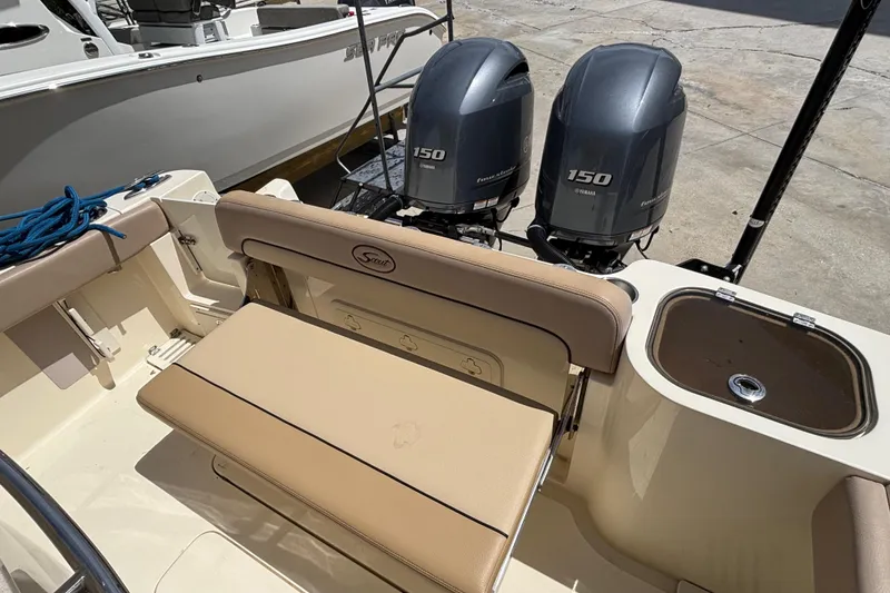 Slide: The Image of 2016 Scout 255 LXF boat with twin Yamaha 150 engines and beige seating. - 5