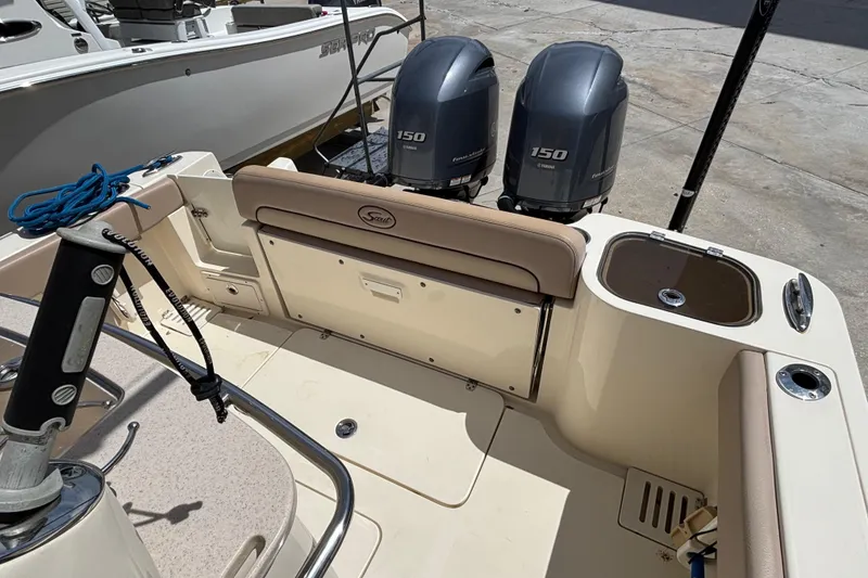 Slide: The Image of 2016 Scout 255 LXF boat with dual Yamaha 150 engines, beige interior. - 9