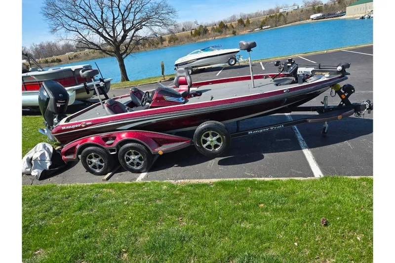 Slide: The Image of 2018 Ranger Z520 Comanche Cup-Equipped boat on trailer by a lake. - 10