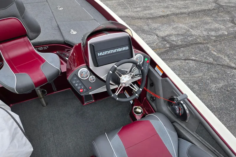 Slide: The Image of 2018 Ranger Z520 Comanche boat cockpit with Humminbird display and red-gray seating. - 12