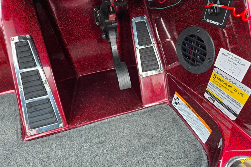 Slide: The Image of 2018 Ranger Z520 Comanche Cup-Equipped boat interior with foot pedals and capacity warning labels. - 15