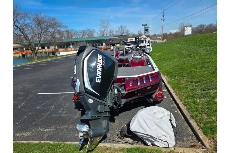 Slide: The Image of 2018 Ranger Z520 Comanche Cup-Equipped boat with Evinrude motor in parking lot. - 2