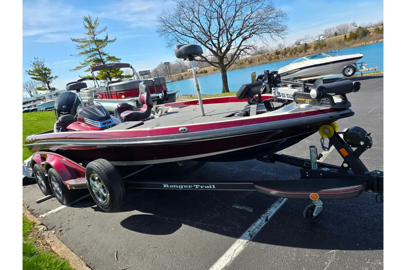 Slide: The Image of 2018 Ranger Z520 Comanche Cup-Equipped boat on trailer by a lakeside. - 9