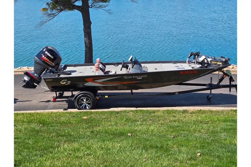 The Image of 2021 G3 Sportsman 1810 boat on trailer by a lake. - 0