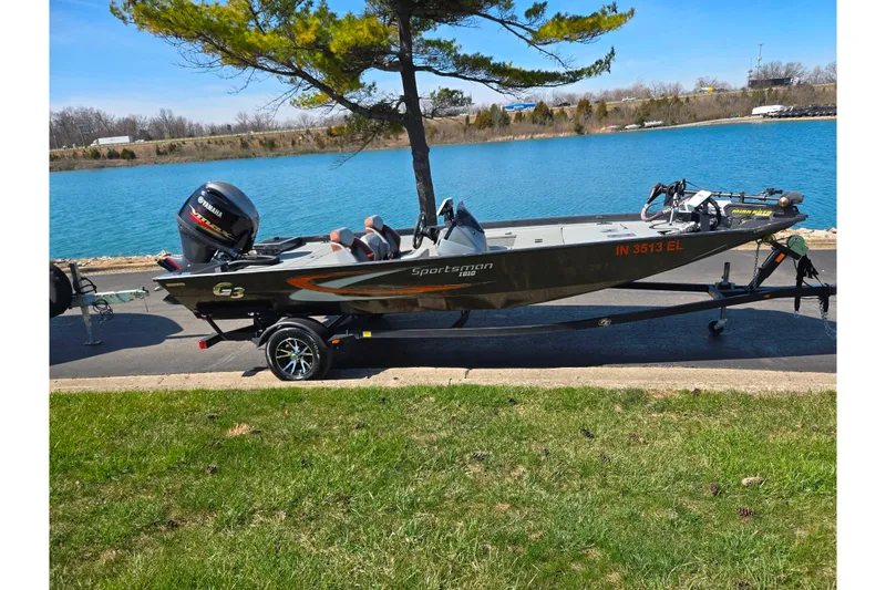 Slide: The Image of 2021 G3 Sportsman 1810 boat on trailer by a lake, sunny day. - 10