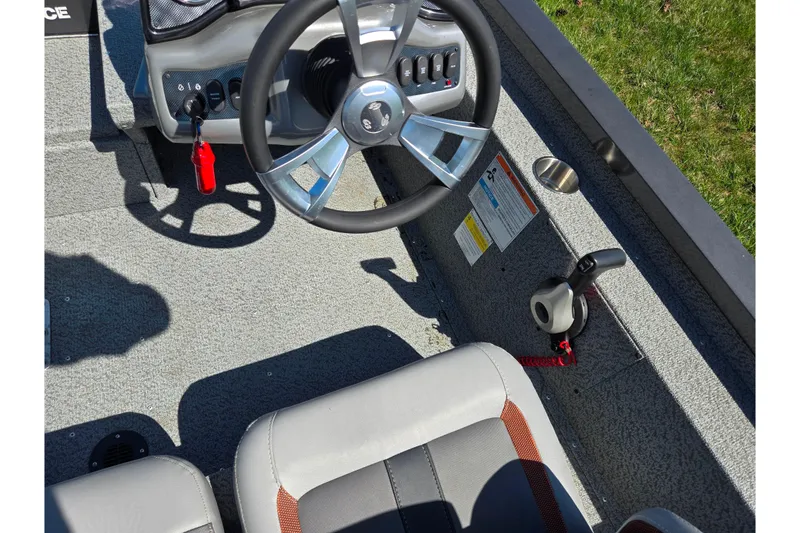 Slide: The Image of 2021 G3 Sportsman 1810 boat interior with steering wheel and control panel. - 12