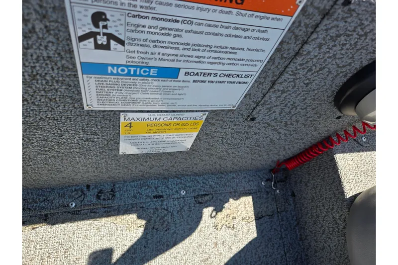 Slide: The Image of 2021 G3 Sportsman 1810 boat safety labels and capacity warning. - 13