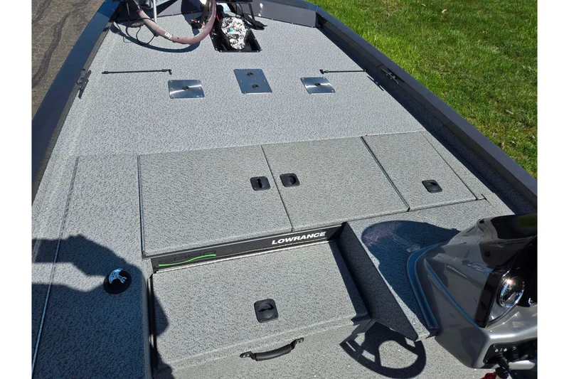 Slide: The Image of 2021 G3 Sportsman 1810 boat deck with storage compartments and Lowrance equipment. - 15