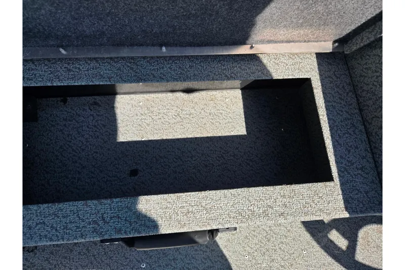 Slide: The Image of Interior storage compartment of 2021 G3 Sportsman 1810 boat, carpeted and empty. - 18