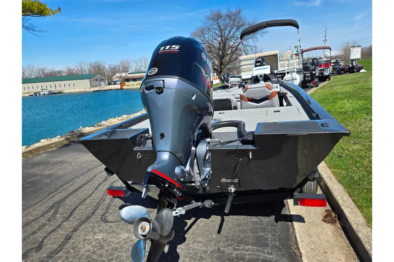 Slide: The Image of 2021 G3 Sportsman 1810 boat with Yamaha 115 outboard motor by a lake. - 2