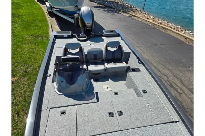 Slide: The Image of 2021 G3 Sportsman 1810 boat on trailer by lakeside road. - 22