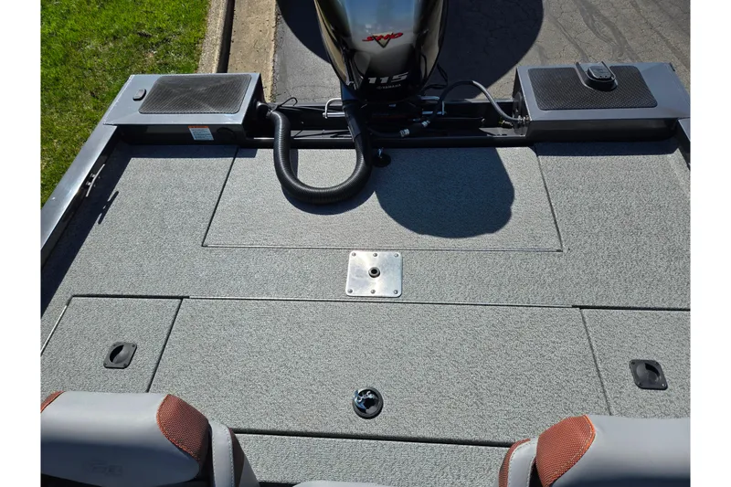 Slide: The Image of 2021 G3 Sportsman 1810 boat deck with Yamaha 115 engine, featuring carpeted surface and storage compartments. - 24