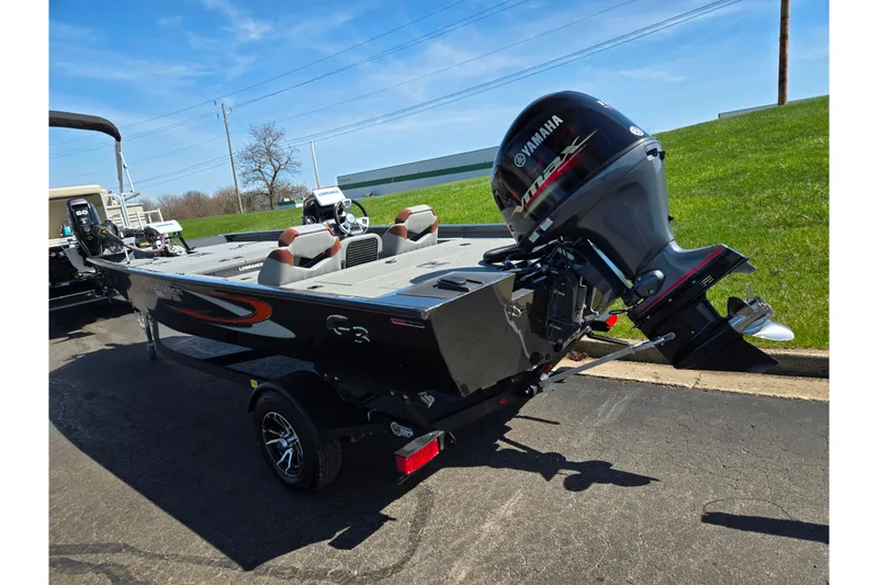 Slide: The Image of 2021 G3 Sportsman 1810 boat with Yamaha motor on a trailer, parked outdoors. - 3