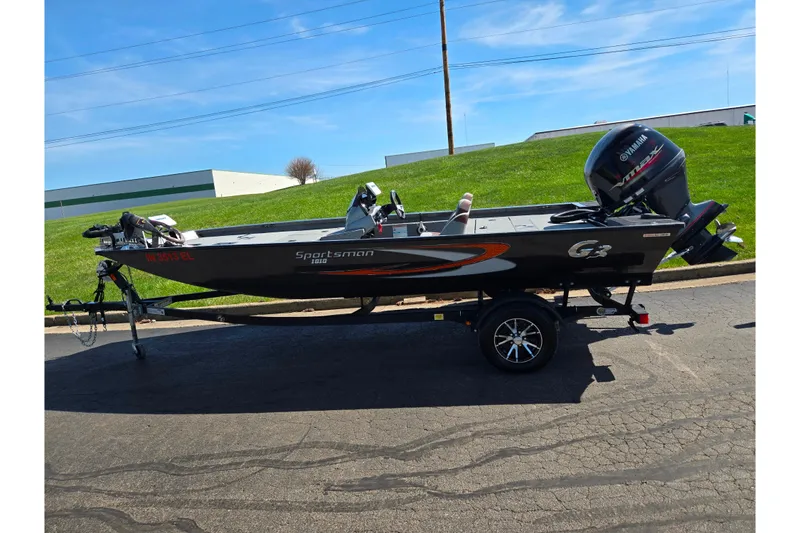 Slide: The Image of 2021 G3 Sportsman 1810 boat on trailer, parked outdoors under clear sky. - 4