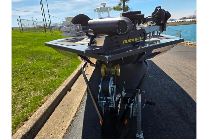 Slide: The Image of 2021 G3 Sportsman 1810 boat with Minn Kota motor on a trailer by a lake. - 7