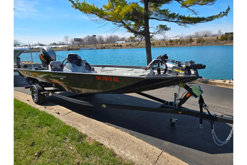 Slide: The Image of 2021 G3 Sportsman 1810 boat on trailer by a lake, under a tree. - 9