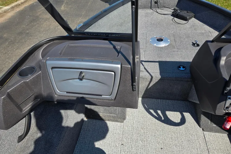 Slide: The Image of 2024 Tracker Pro Guide V-16 WT boat interior with storage compartment and seating area. - 14