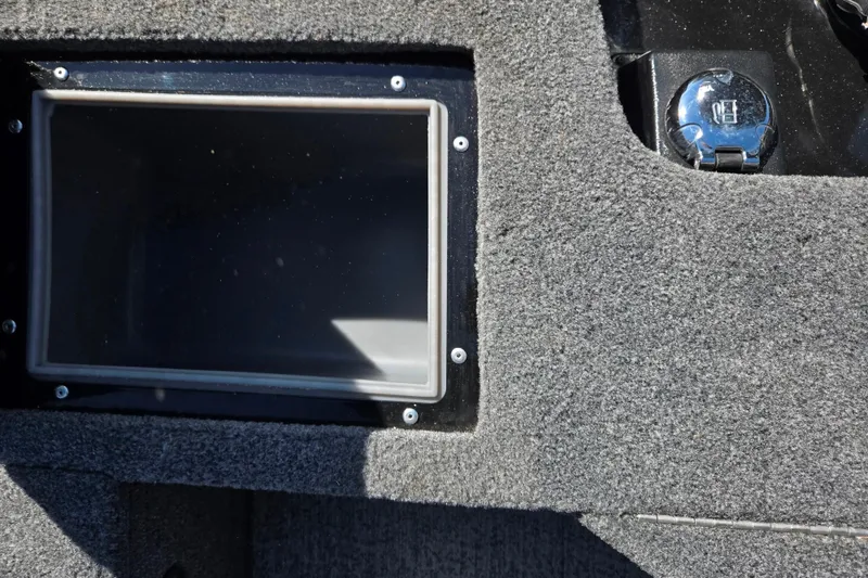 Slide: The Image of 2024 Tracker Pro Guide V-16 WT boat dashboard with a screen and control panel. - 26