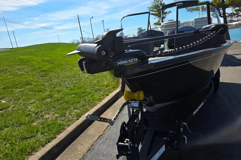 Slide: The Image of 2024 Tracker Pro Guide V-16 WT boat with Minn Kota PowerDrive motor on trailer. - 7