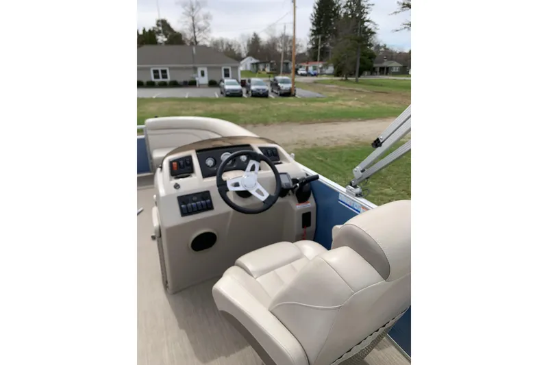 Slide: The Image of 2018 Bennington boat interior with steering wheel and control panel. - 5