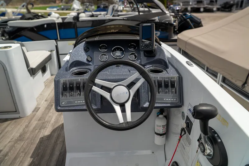 Slide: The Image of Steering console of a 2018 Crest Calypso 190 SL boat. - 7