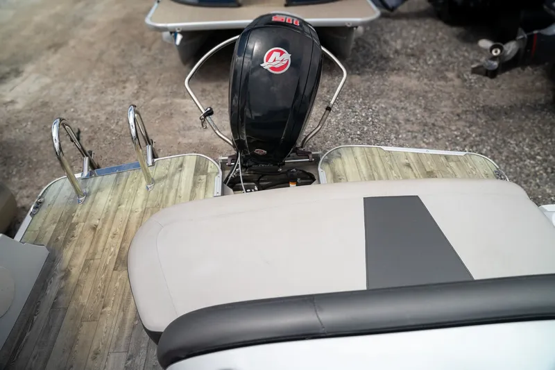 Slide: The Image of Rear view of a 2018 Crest Calypso 190 SL boat with outboard motor. - 8