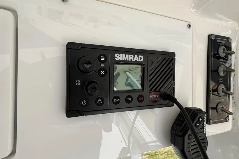 Slide: The Image of Simrad marine radio on 2023 Sea Pro 239 Deep V CC boat dashboard. - 11