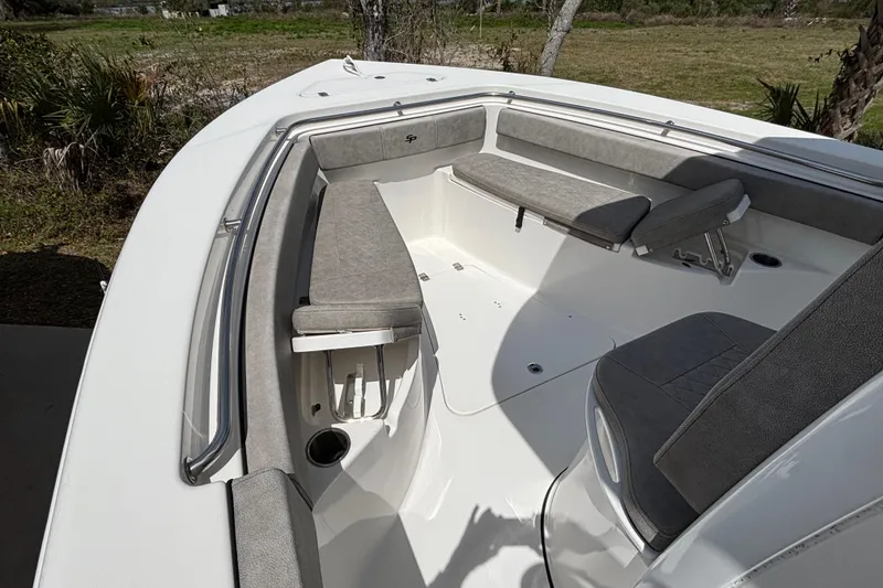 Slide: The Image of 2023 Sea Pro 239 Deep V CC boat interior with cushioned seating and storage compartments. - 16
