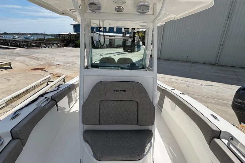 Slide: The Image of 2023 Sea Pro 239 Deep V CC boat interior with seating and console. - 20