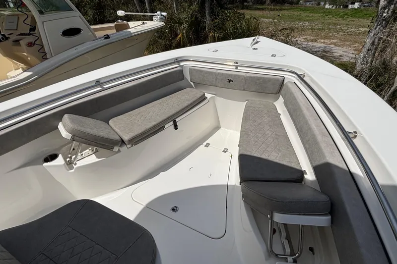 Slide: The Image of 2023 Sea Pro 239 Deep V CC boat interior with cushioned seating and storage. - 21