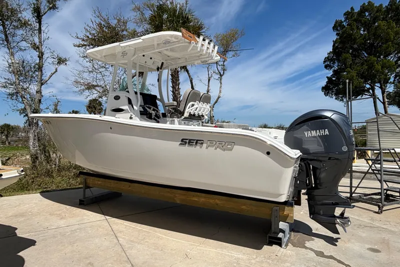 Slide: The Image of 2023 Sea Pro 239 Deep V CC boat with Yamaha engine on display outdoors. - 26
