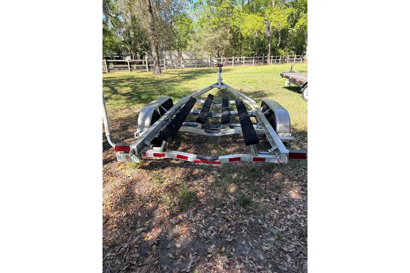 Slide: The Image of Trailer for 2023 Sea Pro 239 Deep V CC boat in a grassy area. - 27