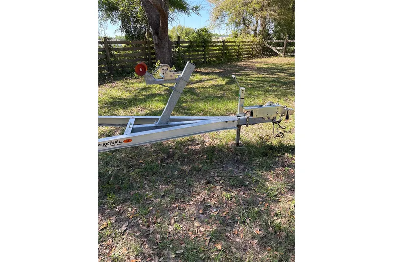 Slide: The Image of Trailer for 2023 Sea Pro 239 Deep V CC boat on grassy area. - 28