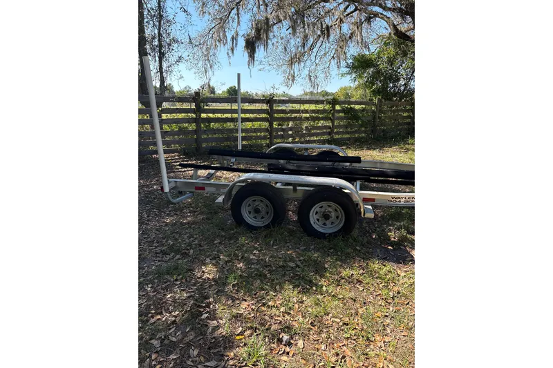 Slide: The Image of Trailer for 2023 Sea Pro 239 Deep V CC boat parked outdoors. - 30