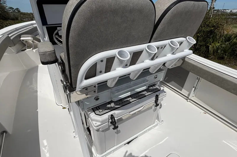 Slide: The Image of 2023 Sea Pro 239 Deep V CC boat interior with rod holders and storage. - 5