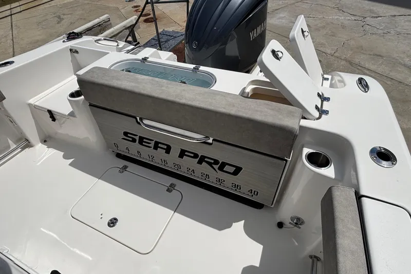 Slide: The Image of 2023 Sea Pro 239 Deep V CC boat interior with seating and storage compartments. - 9