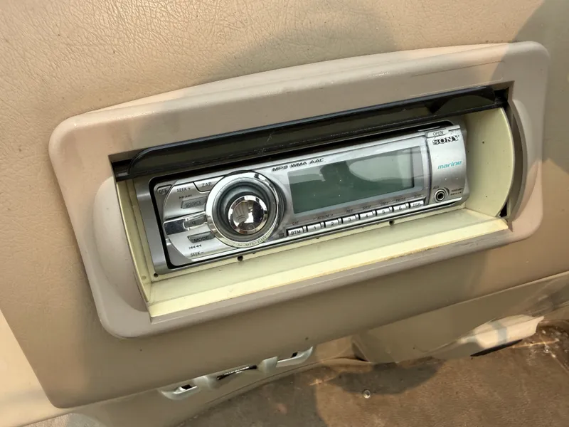 Slide: The Image of A Sony car stereo is installed in a beige dashboard. - 19