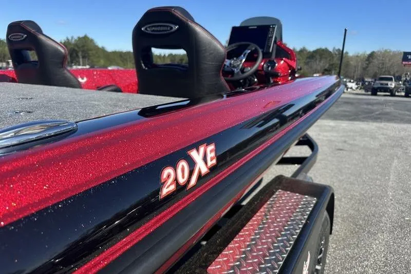 Slide: The Image of 2026 Phoenix 20 XE boat with sleek red and black design on trailer. - 4
