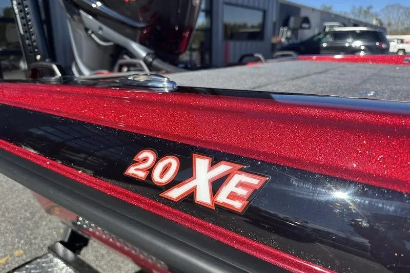Slide: The Image of Red Phoenix 20 XE boat, 2026 model, with metallic finish and bold lettering. - 5