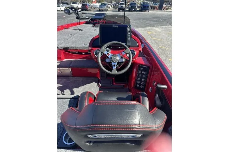 Slide: The Image of 2026 Phoenix 20 XE boat cockpit with steering wheel and navigation display. - 6
