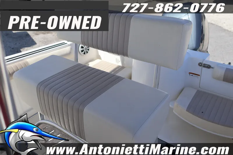 Slide: The Image of Pre-owned 2004 Aquasport 205 Osprey boat interior with seating details. - 17
