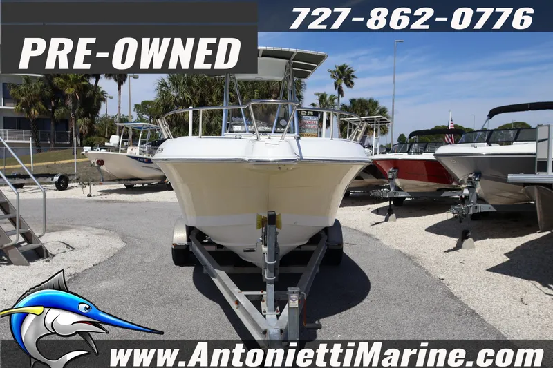 Slide: The Image of Pre-owned 2004 Aquasport 205 Osprey boat on trailer at Antonietti Marine dealership. - 2
