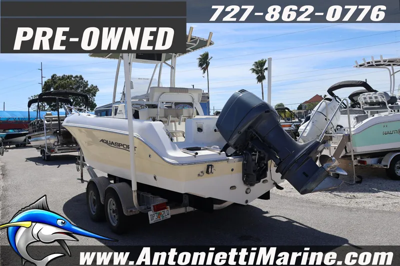 Slide: The Image of Pre-owned 2004 Aquasport 205 Osprey boat displayed at Antonietti Marine dealership. - 4
