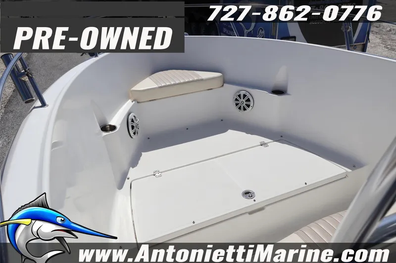 Slide: The Image of Pre-owned 2004 Aquasport 205 Osprey boat interior with seating and speakers. - 8