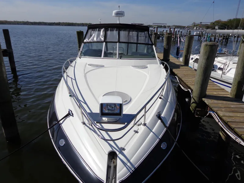 Slide: The Image of 2008 Cruisers Yachts 330 Express docked at a marina, front view. - 20