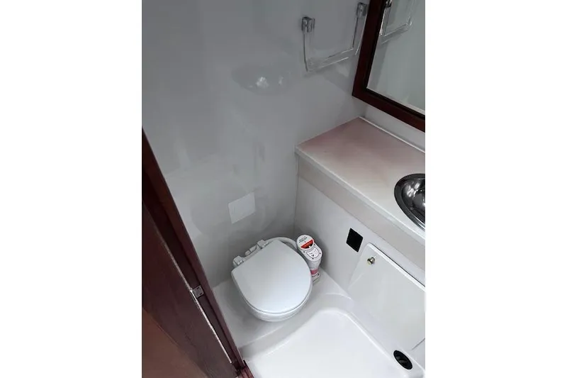 Slide: The Image of Bathroom interior of 1996 Bayliner 3388 Command Bridge Motoryacht with toilet and sink. - 16