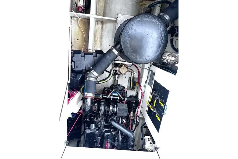 Slide: The Image of Engine compartment of a 1996 Bayliner 3388 Command Bridge Motoryacht, showing mechanical components. - 32