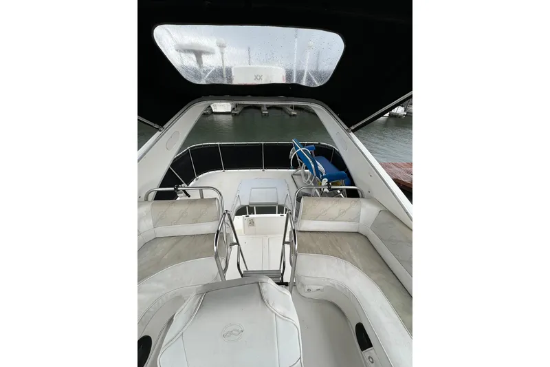 Slide: The Image of 1996 Bayliner 3388 Command Bridge Motoryacht interior with seating and water view. - 38