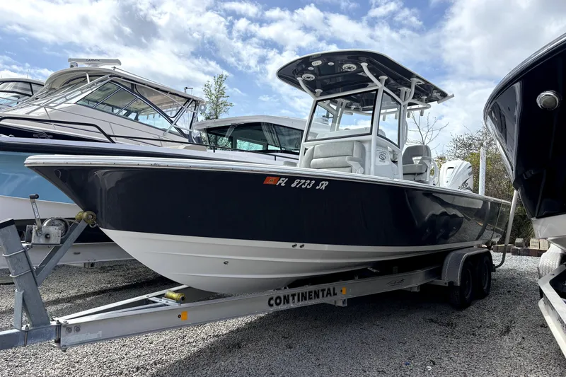 The Image of 2020 Sportsman Masters 267OE Bay Boat on trailer, parked outdoors. - 0